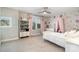 Charming bedroom featuring a ceiling fan, neutral walls, and a floral accent wall at 114 Tomahawk Dr, Mooresville, NC 28117