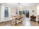 Cozy dining area with sliding door to outdoor deck with wooded view at 114 Tomahawk Dr, Mooresville, NC 28117