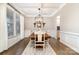 Elegant dining room with coffered ceilings, hardwood floors, and wainscoting at 114 Tomahawk Dr, Mooresville, NC 28117