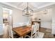 Bright dining room with hardwood floors and modern lighting fixture at 114 Tomahawk Dr, Mooresville, NC 28117