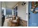 Inviting front porch with rocking chairs, swing, and neutral decor at 114 Tomahawk Dr, Mooresville, NC 28117