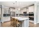 Stylish kitchen with stainless steel appliances, gray backsplash, and large island with seating at 114 Tomahawk Dr, Mooresville, NC 28117