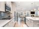 Well-equipped kitchen with stainless appliances opens to dining area at 114 Tomahawk Dr, Mooresville, NC 28117