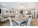 Open-concept kitchen, dining, and living space with hardwood floors at 114 Tomahawk Dr, Mooresville, NC 28117