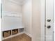 Mudroom featuring built-in storage with a bench, hooks, and cubbies for shoes and bags at 114 Tomahawk Dr, Mooresville, NC 28117