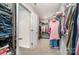 Spacious walk-in closet with shelving and hanging racks for optimal organization and storage at 114 Tomahawk Dr, Mooresville, NC 28117
