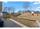 A large fenced yard with a wooden fence viewed from a raised deck in the backyard at 131 Lowry Row # 8, York, SC 29745