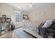 Bright bedroom with a white wooden bed frame, floral bedding, and a matching dresser at 131 Lowry Row # 8, York, SC 29745