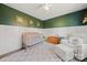 Inviting Bedroom features a crib, plush rug, an accent wall, and a comfortable rocking chair at 131 Lowry Row # 8, York, SC 29745