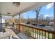 Inviting front porch view with wooden railings, offering a glimpse of the neighborhood at 131 Lowry Row # 8, York, SC 29745