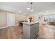Open-concept kitchen island with seating connects to the living area, perfect for entertaining and Gathering gatherings at 131 Lowry Row # 8, York, SC 29745