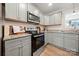Kitchen features stainless steel appliances, gray cabinets, and granite countertops at 131 Lowry Row # 8, York, SC 29745