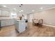 Open concept kitchen featuring gray cabinets, granite countertops, and eat-in dining area at 131 Lowry Row # 8, York, SC 29745