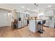 Modern kitchen with gray cabinets, granite countertops, stainless steel appliances, and a functional center island at 131 Lowry Row # 8, York, SC 29745