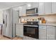 Modern kitchen with stainless steel appliances and granite countertops at 131 Lowry Row # 8, York, SC 29745