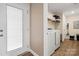 Convenient laundry room with washer, dryer, and storage shelves at 131 Lowry Row # 8, York, SC 29745