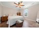 Bedroom features a large window, wood-look floors, and neutral decor at 131 Lowry Row # 8, York, SC 29745