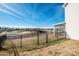 Scenic backyard view with a black fence, overlooking a tranquil lake and community at 140 Jana Dr, Statesville, NC 28677