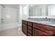 Bright bathroom with double sink vanity, granite countertops, and shower-tub combination at 140 Jana Dr, Statesville, NC 28677