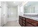 Well-lit bathroom featuring a double sink vanity, granite countertops and a shower-tub combination at 140 Jana Dr, Statesville, NC 28677