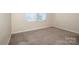 Bright bedroom with neutral walls and carpet, with natural light from the windows at 140 Jana Dr, Statesville, NC 28677