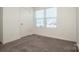 Carpeted bedroom with two bright windows at 140 Jana Dr, Statesville, NC 28677