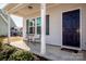 Covered front porch with seating and a view of the entrance to the residence at 140 Jana Dr, Statesville, NC 28677