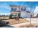 Two-story home with landscaped yard on a sunny day in a Gathering neighborhood at 140 Jana Dr, Statesville, NC 28677