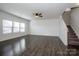 Spacious living room with natural light, hardwood floors and staircase to the upper level at 140 Jana Dr, Statesville, NC 28677