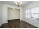 Bright and airy living room with wood floors, large windows and chandelier at 140 Jana Dr, Statesville, NC 28677