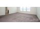 Large carpeted main bedroom with three windows that provide natural light at 140 Jana Dr, Statesville, NC 28677