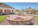 Inviting outdoor kitchen with a built-in grill and fire pit, ideal for entertaining and enjoying outdoor meals at 140 Jana Dr, Statesville, NC 28677