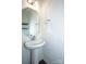 Small powder room with a pedestal sink and octagon mirror at 140 Jana Dr, Statesville, NC 28677