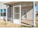 Screened in porch with white frame and door, offering a relaxing outdoor space with access to the home at 140 Jana Dr, Statesville, NC 28677