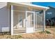 A screened-in porch with a white door that leads into the house and screens to keep out the bugs at 140 Jana Dr, Statesville, NC 28677