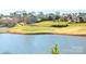 Serene view overlooking a lush green golf course and calm waters, creating a picturesque setting at 140 Jana Dr, Statesville, NC 28677