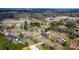 Wide aerial view showing the property within a serene landscape with scattered homes and greenery at 1818 Valley Springs Se Dr, Conover, NC 28613