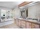 Spacious bathroom boasts a large tub, double vanity, and decorative mirrors at 1818 Valley Springs Se Dr, Conover, NC 28613