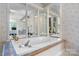 Large soaking tub with jets in a Primary bathroom with beautiful tiling and mirrors at 1818 Valley Springs Se Dr, Conover, NC 28613
