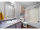 Bathroom with vanity, toilet, tub and shower featuring a shower curtain and overhead storage at 1818 Valley Springs Se Dr, Conover, NC 28613