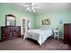 Cozy bedroom with carpet and a classic dresser and ample natural light at 1818 Valley Springs Se Dr, Conover, NC 28613