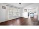 Inviting dining room featuring large windows and views into the kitchen area at 1818 Valley Springs Se Dr, Conover, NC 28613