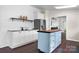 Modern kitchen showcasing custom island, white cabinets, and an open floor plan at 1818 Valley Springs Se Dr, Conover, NC 28613