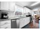 Well-lit kitchen featuring stainless steel appliances, white cabinets, and granite countertops at 1818 Valley Springs Se Dr, Conover, NC 28613