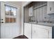 Functional laundry area with washer, dryer, and exterior access door with window at 1818 Valley Springs Se Dr, Conover, NC 28613