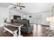 Bright living room with hardwood floors, a fireplace, and access to an outdoor patio at 1818 Valley Springs Se Dr, Conover, NC 28613