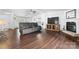 Open living area showcasing hard floors, a fireplace, and plenty of natural light at 1818 Valley Springs Se Dr, Conover, NC 28613