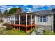 Inviting covered porch with swing and outdoor seating, perfect for relaxing at 1818 Valley Springs Se Dr, Conover, NC 28613
