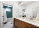 Bright bathroom featuring a double vanity with stylish faucets and a beautifully tiled tub and shower at 297 Greenwood Ave, Belmont, NC 28012