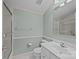 Well-maintained bathroom features a white vanity, toilet, and shower with a glass door at 305 Wagner St, Troutman, NC 28166